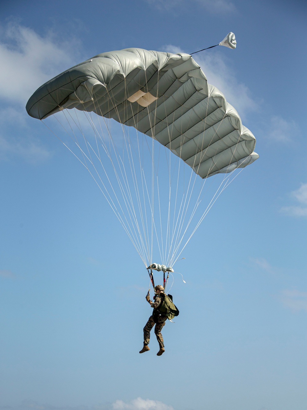 Riggers and Recon Marines jump over Ie Shima