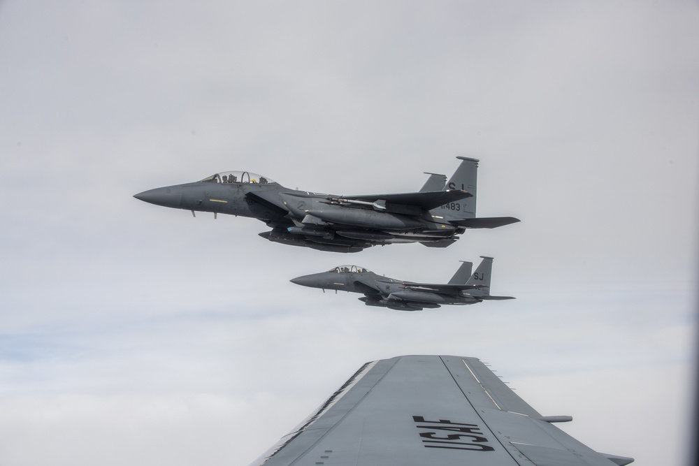 KC-46 A Pegasus, Four F-15 E Strike Eagles hookup for refueling operations