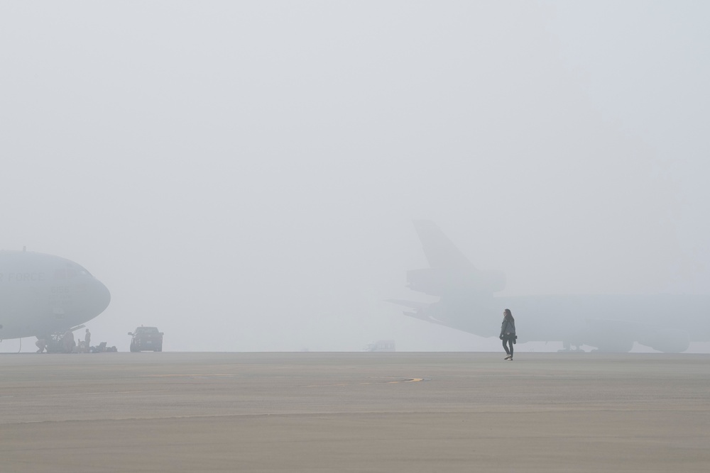 Public affairs photographer searches for photo opportunity on flight line