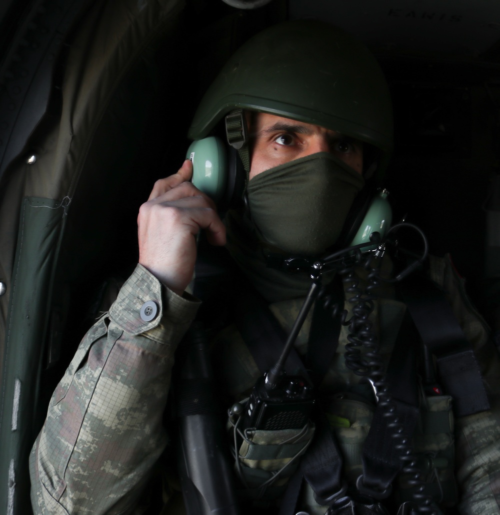 Turkish KFOR troop rides Blackhawk to conduct ABL patrol