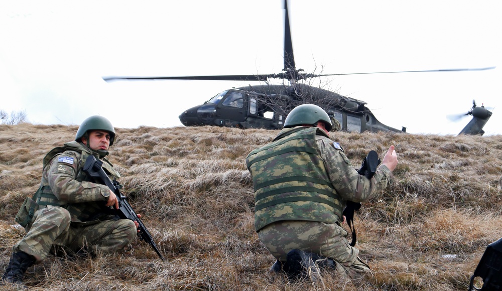 Turkish KFOR troops ride Blackhawk to conduct ABL patrol