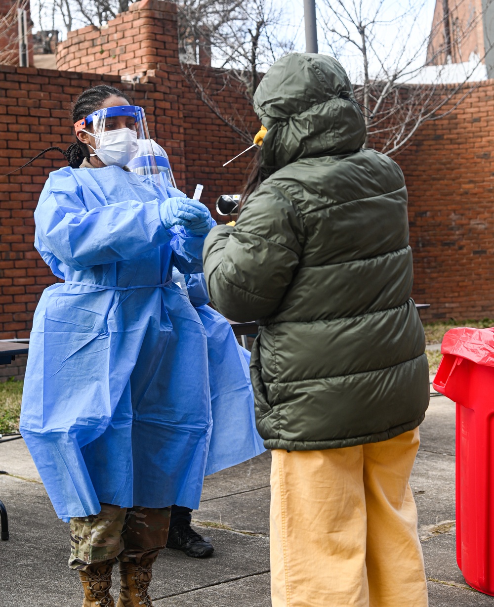 Members of the Maryland National Guard assists residents with COVID-19 self testing in Baltimore Maryland.