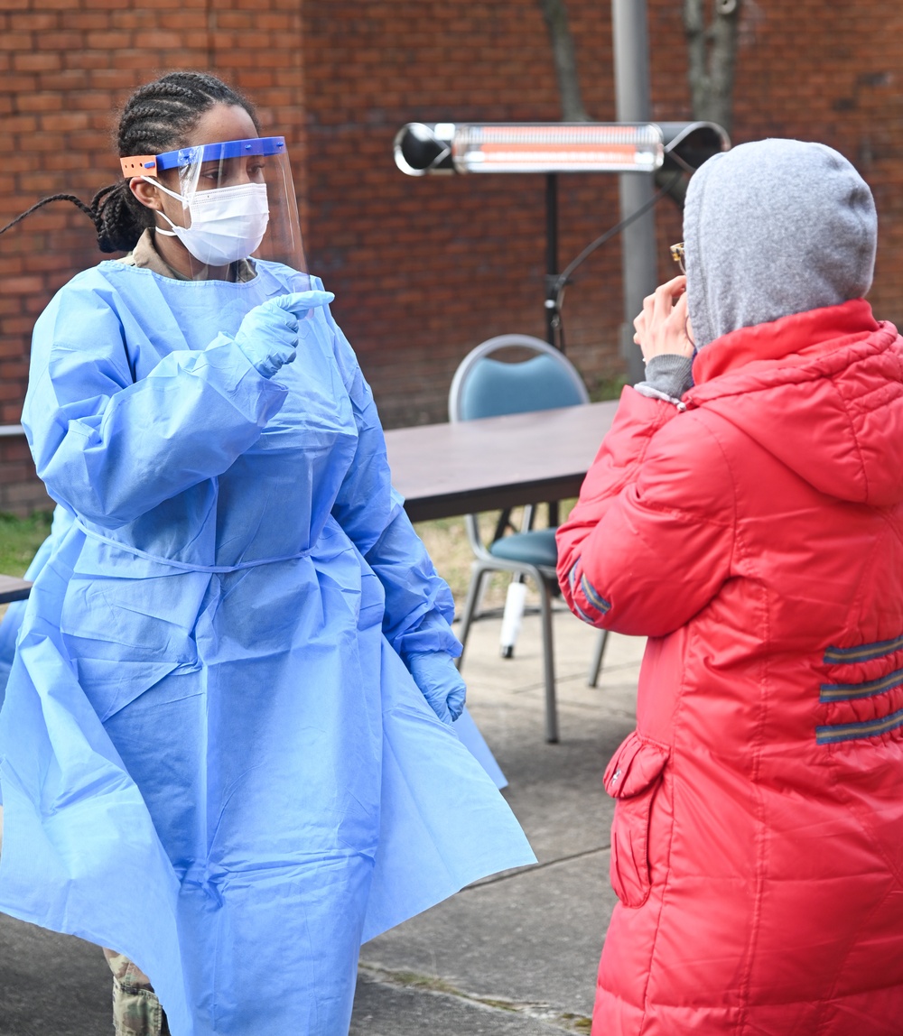 Members of the Maryland National Guard assists residents with COVID-19 self testing in Baltimore Maryland.