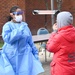 Members of the Maryland National Guard assists residents with COVID-19 self testing in Baltimore Maryland.