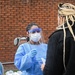 Members of the Maryland National Guard assists residents with COVID-19 self testing in Baltimore Maryland.