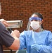 Members of the Maryland National Guard assists residents with COVID-19 self testing in Baltimore Maryland