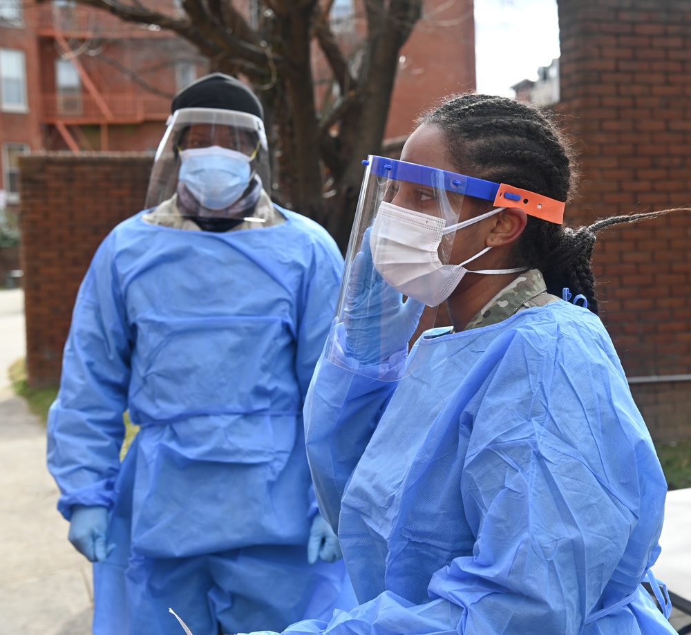 Members of the Maryland National Guard assists residents with COVID-19 self testing in Baltimore Maryland