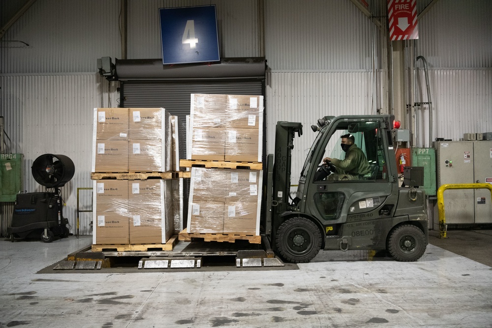 60th APS Airmen receive and palletize N-95 masks