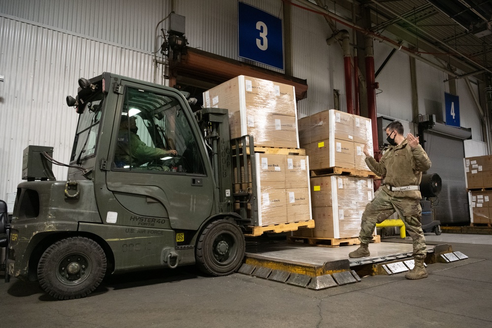 60th APS Airmen receive and palletize N-95 masks