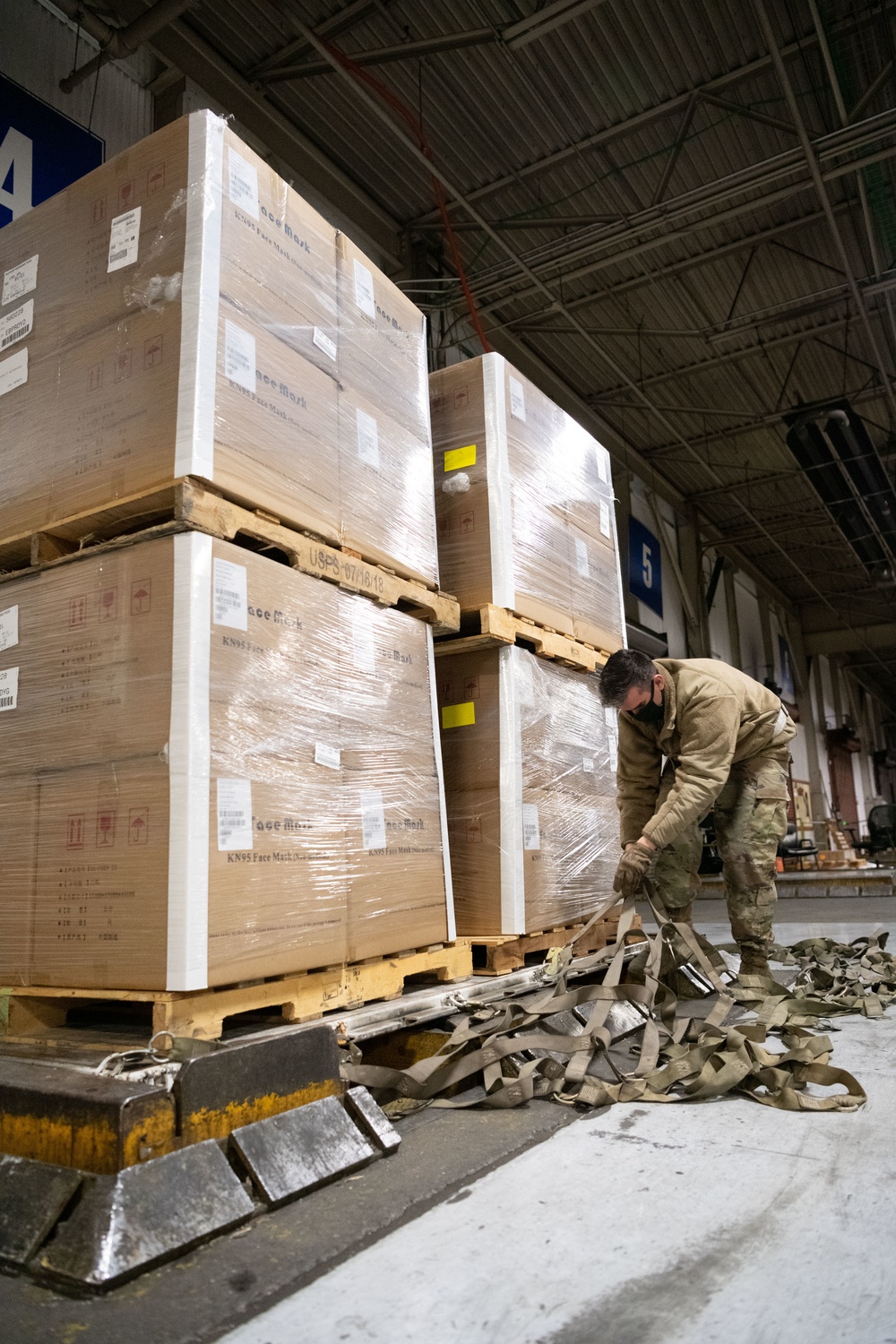 60th APS Airmen receive and palletize N-95 masks