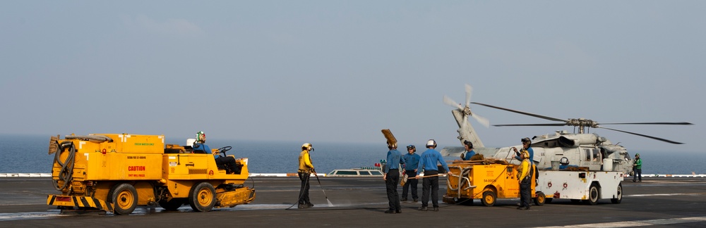 Sailors Perform Washdown
