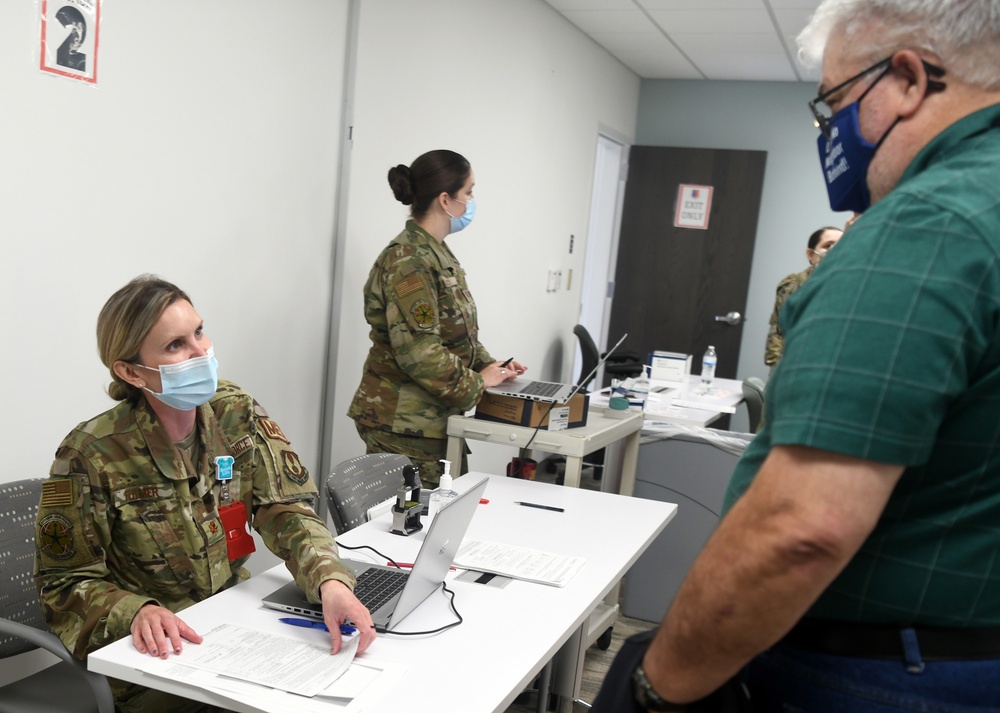 Robins administers COVID vaccine second doses
