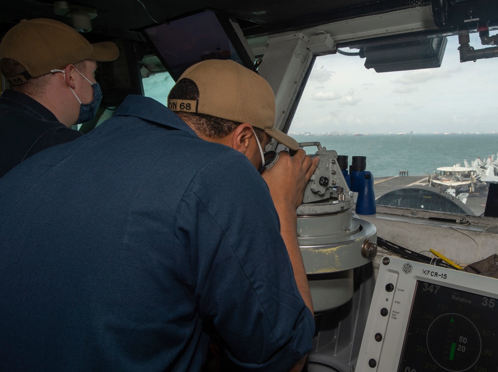 USS Nimitz Transits Strait Of Malacca