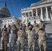 D.C. National Guard Public Affairs team pose in front of U.S. Capitol after 59th Presidential Inauguration