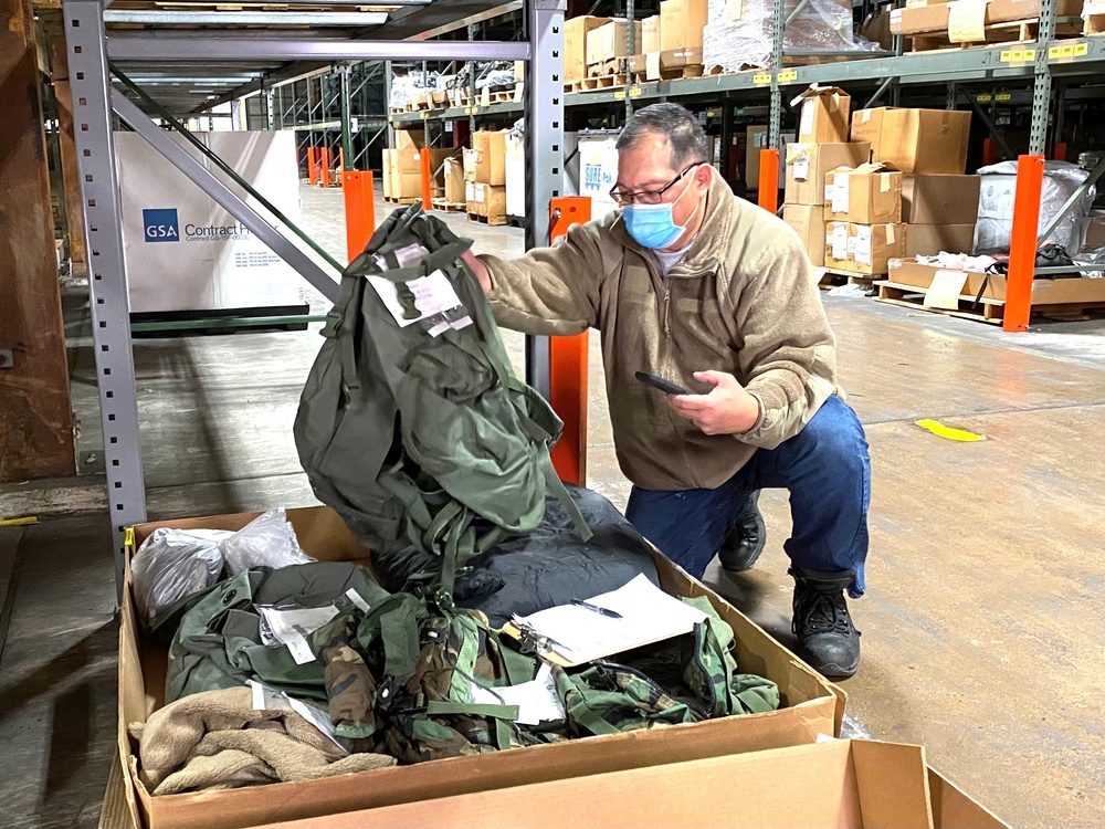 Disposal Services Representative Allan Coronacion inspects excess equipment warehoused at the Defense Logistics Agency Disposition Services property disposal field site in Susquehanna, PA