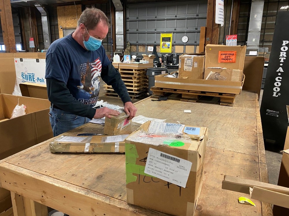 Material Examiner and Identifier Gregory Bryan performs receipt evaluations of turn-in property at the Defense Logistics Agency Disposition Services