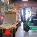 Material Examiner and Identifier Greg Reigle moves pallets of excess DOD goods