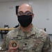 A Soldier from Bravo Battery, 5th Battalion, 52nd Artillery Regiment, receives Operations Spartan Shield coin from Task Force Spartan leadership