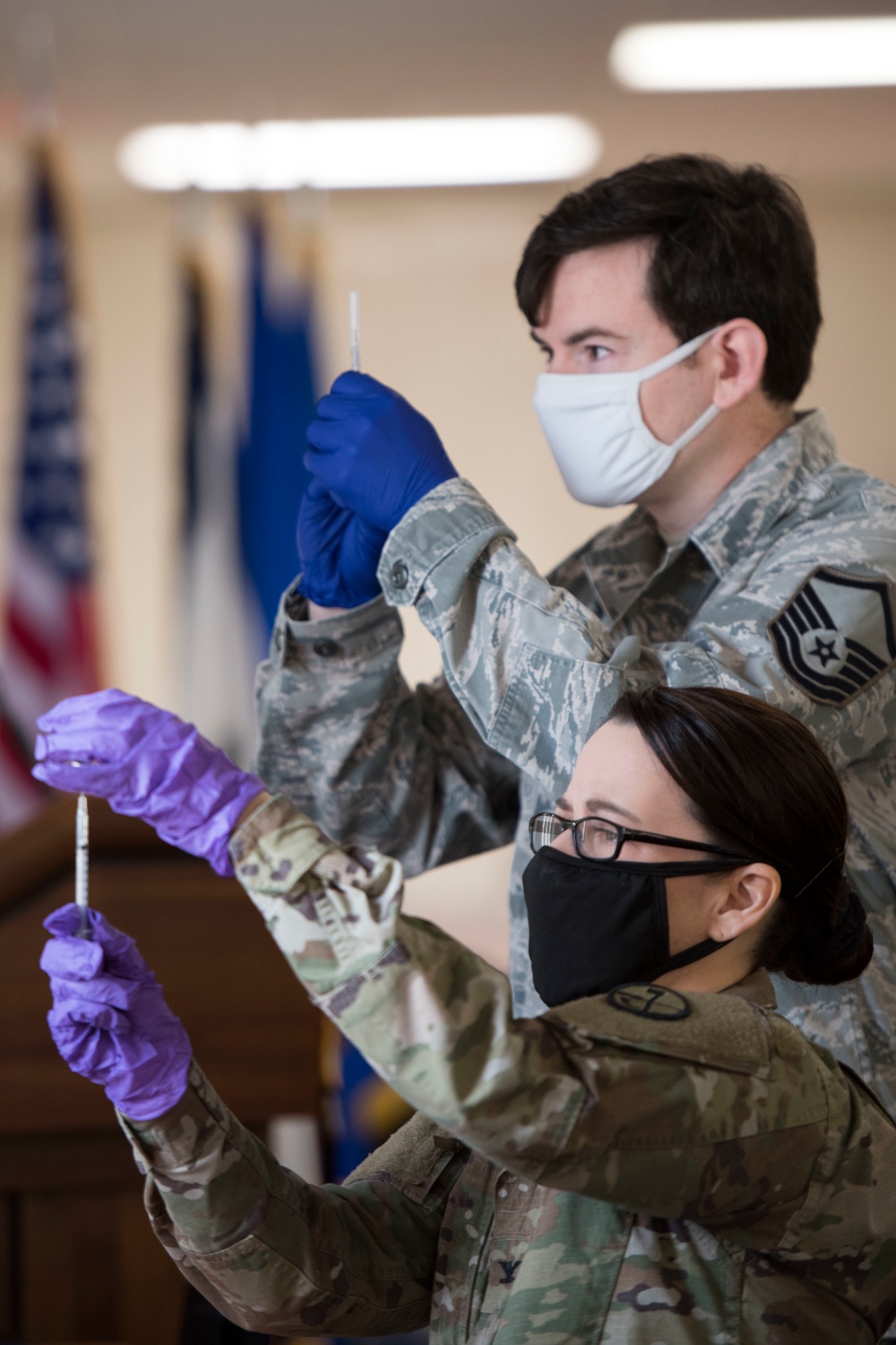 Airmen voluntarily receive COVID-19 vaccine