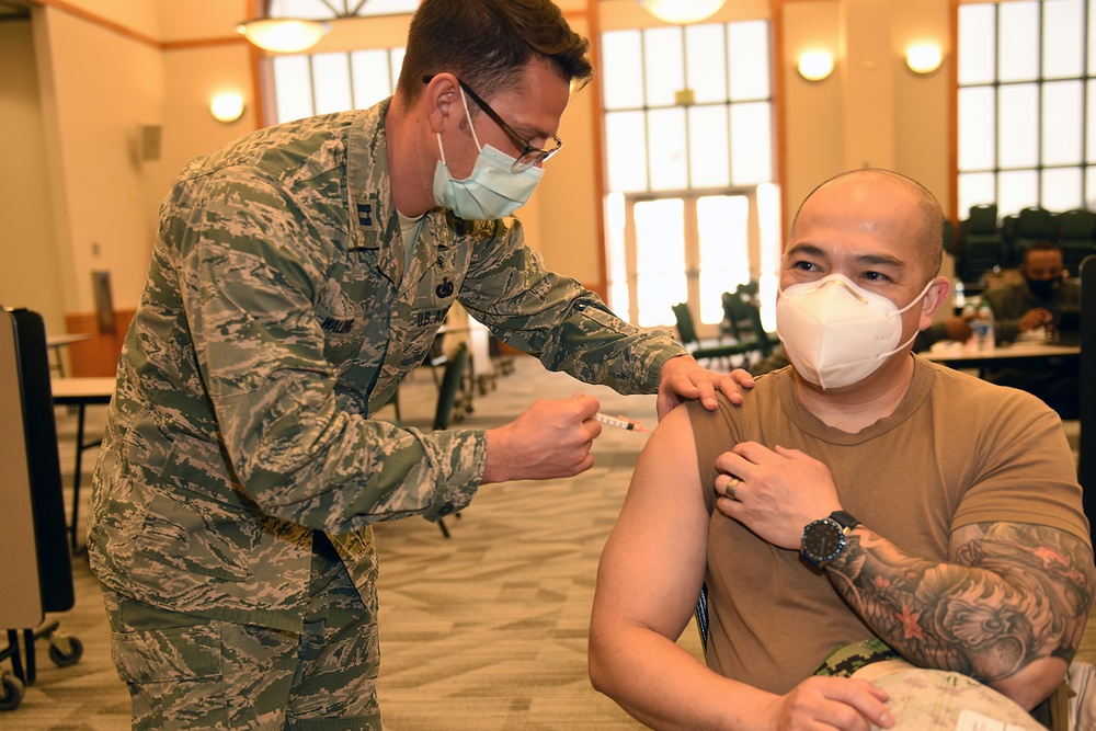 U.S. Army and Air Medics with the MING, 127th Wing, and Task Force Red lion, Administers the COVID-19 Vaccine