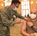 U.S. Army and Air Medics with the MING, 127th Wing, and Task Force Red lion, Administers the COVID-19 Vaccine