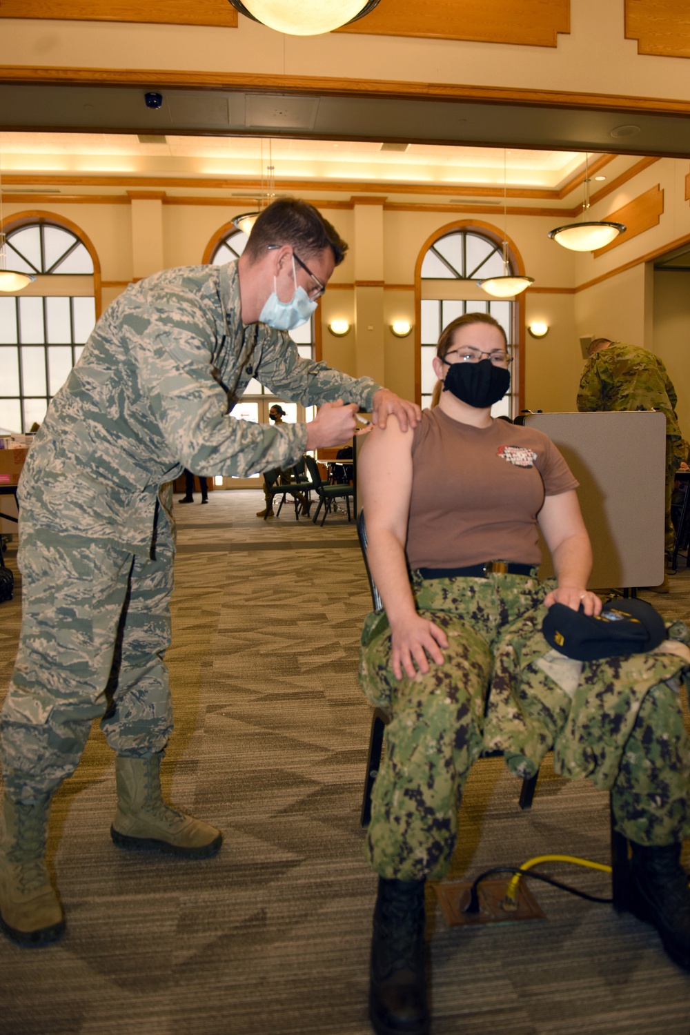 U.S. Army and Air Medics with the MING, 127th Wing, and Task Force Red lion, Administers the COVID-19 Vaccine