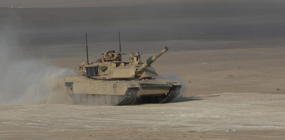 An M-1 Abrams tank, 1-6 IN, speeds toward simulated medevac, Iron Union 14