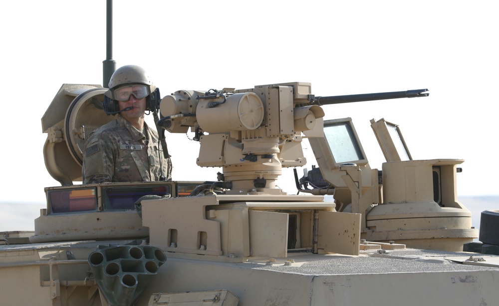 A U.S. Army Soldier assigned to 1-6 IN, 2-1 ABCT, provides security in an M-1 Abrams tank