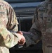 Soldier from 5-52nd ADA receives coin from TFS commander