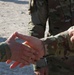 Soldier from 5-52nd ADA receives coin from TFS commander