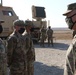 Soldier from 5-52nd ADA receives coin from TFS commander