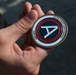 Soldier from 5-52nd ADA receives coin from USARCENT leadership