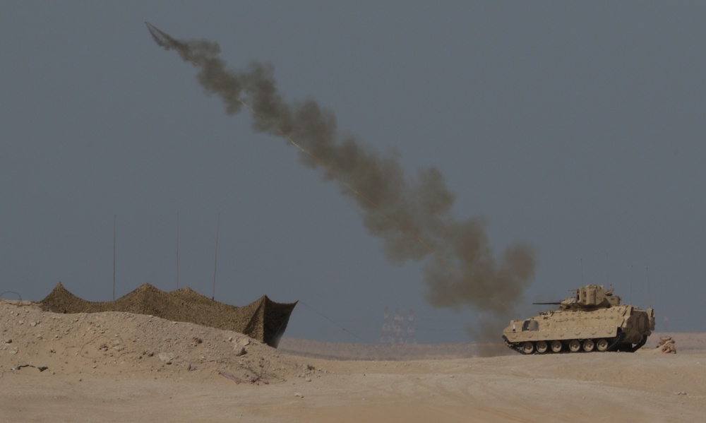 A U.S. Army M1150 Assault Breacher Vehicle from 1st Battalion, 6th Infantry Regiment, 2nd Brigade Combat Team, 1st Armored Division, launches its Linear Demolition Charge System during a live-fire exercise