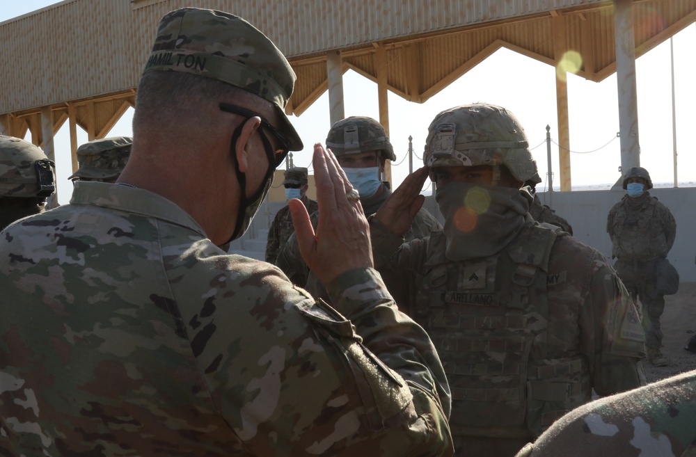 A U.S. Army Soldier from 1st Bn., 6th Inf. Reg., salutes Maj. Gen. Patrick Hamilton, commanding general TFS