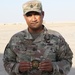 Sgt. Maj. Holi Holi, operations sergeant major for 1st Bn., 6th Inf. Reg., poses with Task Force Spartan challenge coin