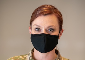 Photo of 1st Lt. Shelley Warren displaying the new hairstyle allowed for Air Force women