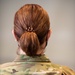 Photo of 1st Lt. Shelley Warren displaying the new hairstyle allowed for Air Force women