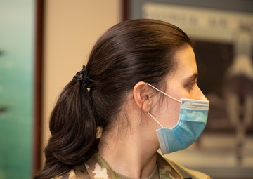 Photo of Tech. Sgt. Cher Schwein displaying the new hairstyle allowed for Air Force women