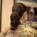 Photo of Tech. Sgt. Cher Schwein displaying the new hairstyle allowed for Air Force women