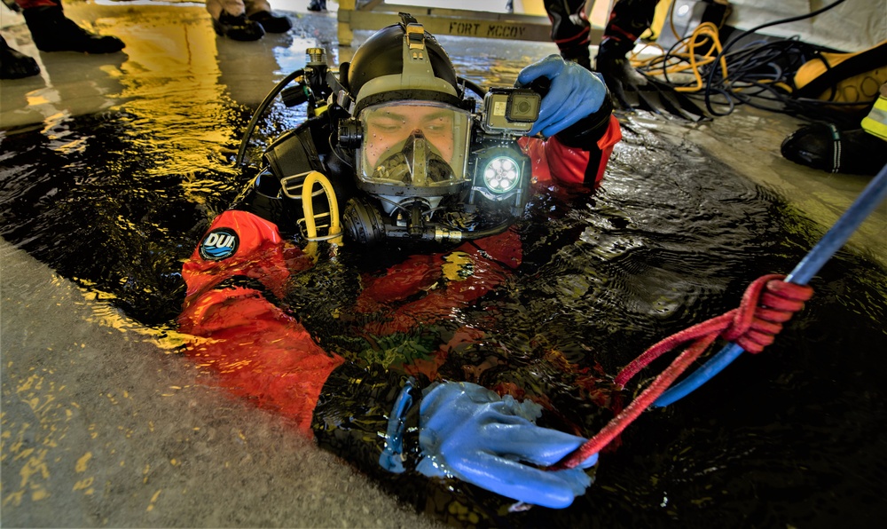 Fort McCoy firefighters practice diving under ice at post’s Big Sandy Lake