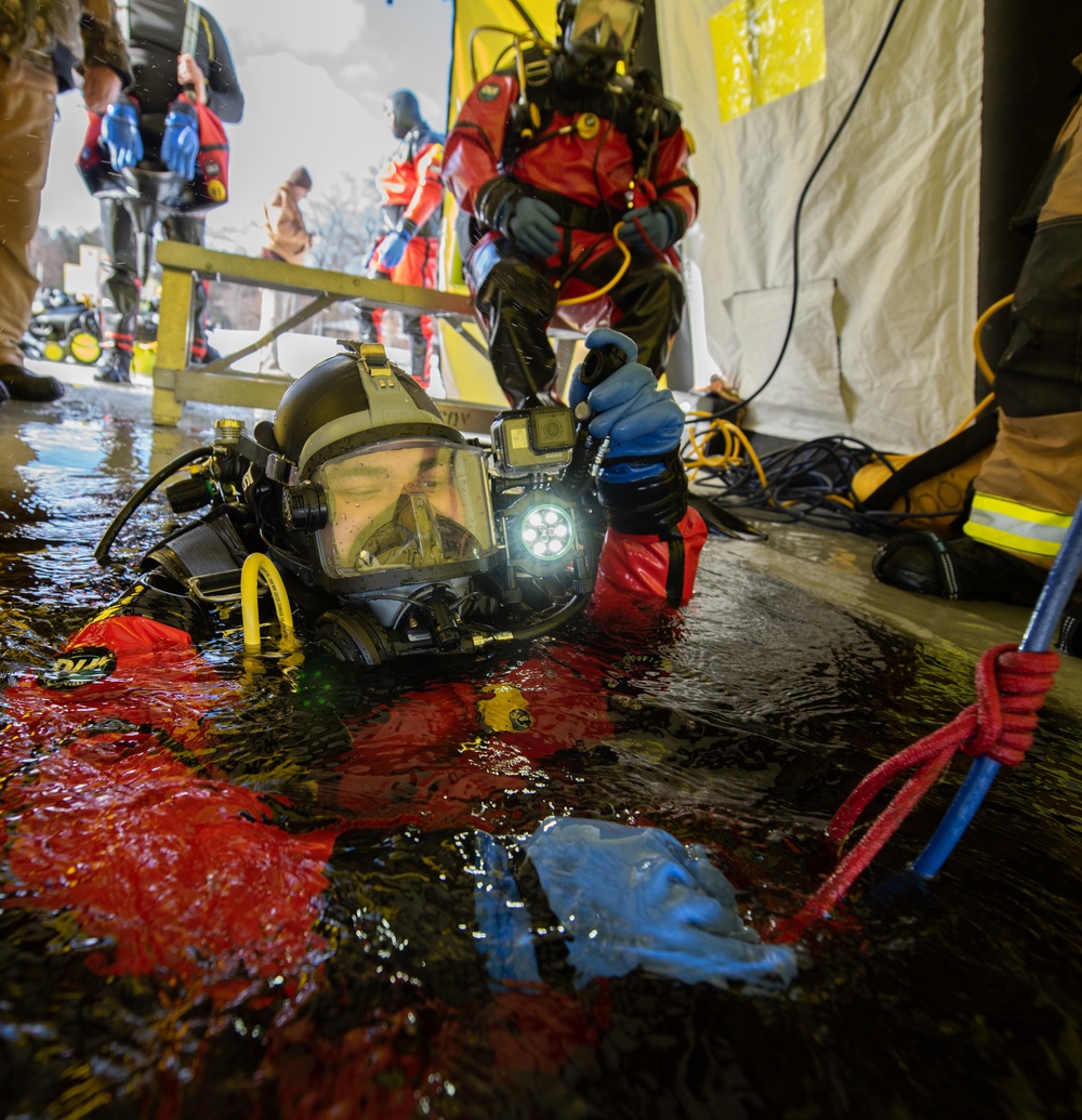 Fort McCoy firefighters practice diving under ice at post’s Big Sandy Lake