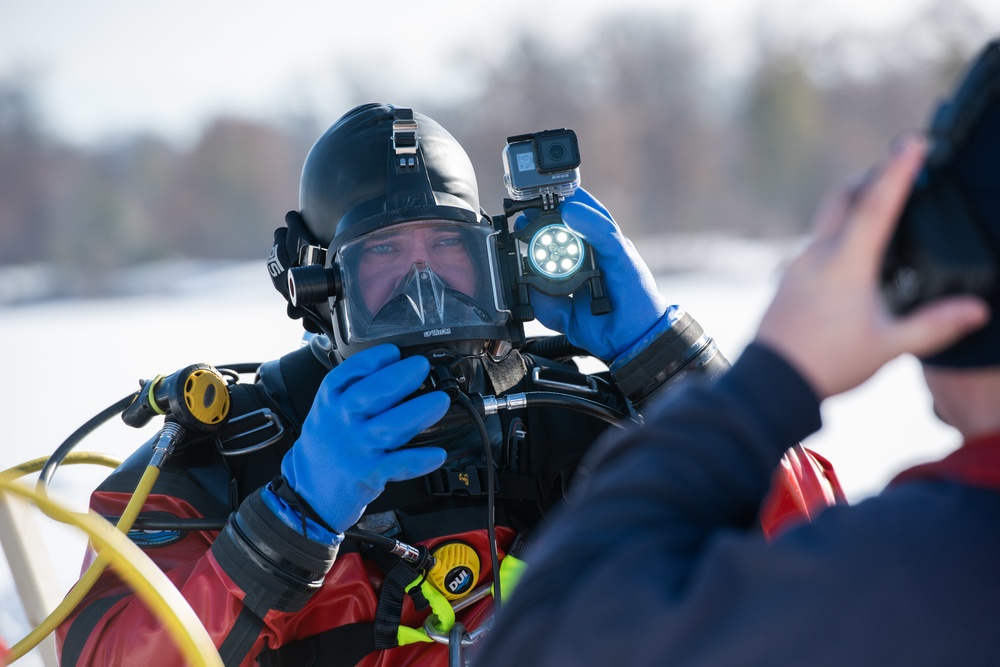 Fort McCoy firefighters practice diving under ice at post’s Big Sandy Lake