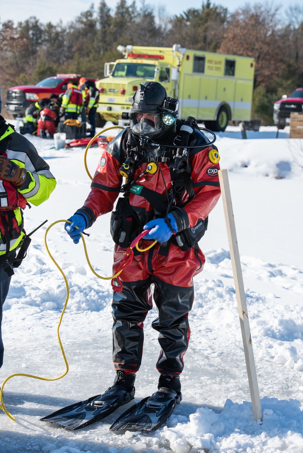 Fort McCoy firefighters practice diving under ice at post’s Big Sandy Lake