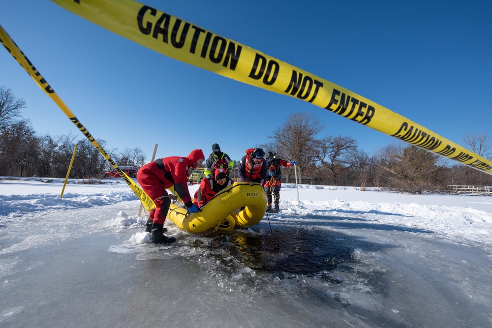 Fort McCoy firefighters practice diving under ice at post’s Big Sandy Lake