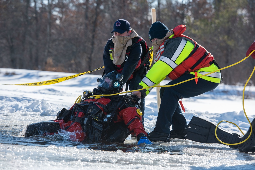 Fort McCoy firefighters practice diving under ice at post’s Big Sandy Lake