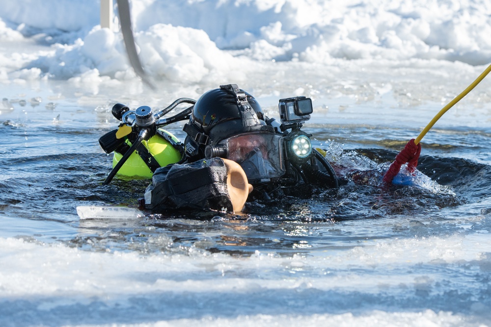 Fort McCoy firefighters practice diving under ice at post’s Big Sandy Lake