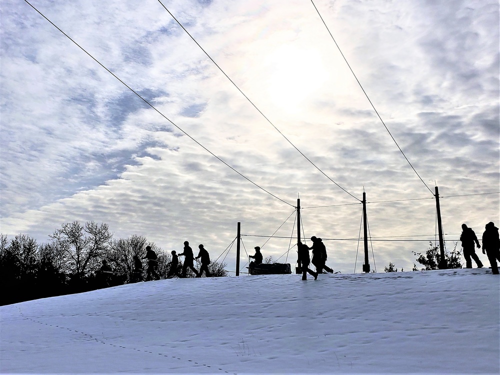 Fort McCoy CWOC class 21-03 students train using snowshoes, ahkio sleds