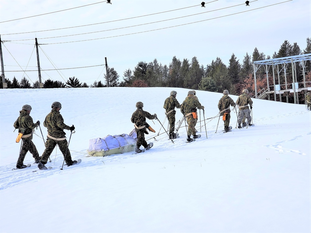 Fort McCoy CWOC class 21-03 students train using snowshoes, ahkio sleds