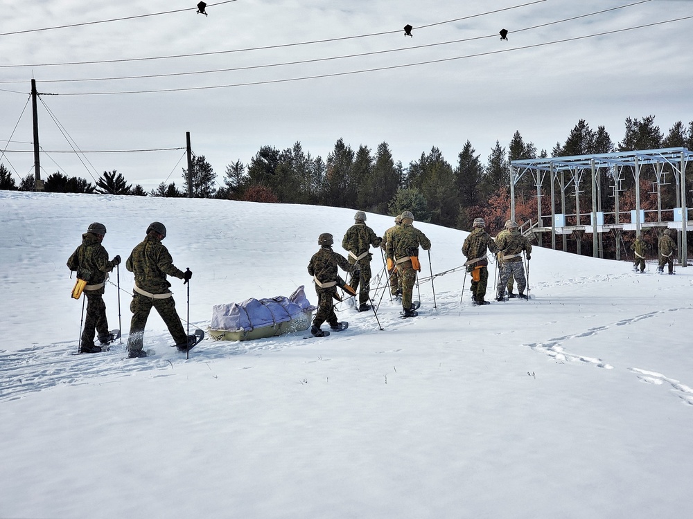 Fort McCoy CWOC class 21-03 students train using snowshoes, ahkio sleds