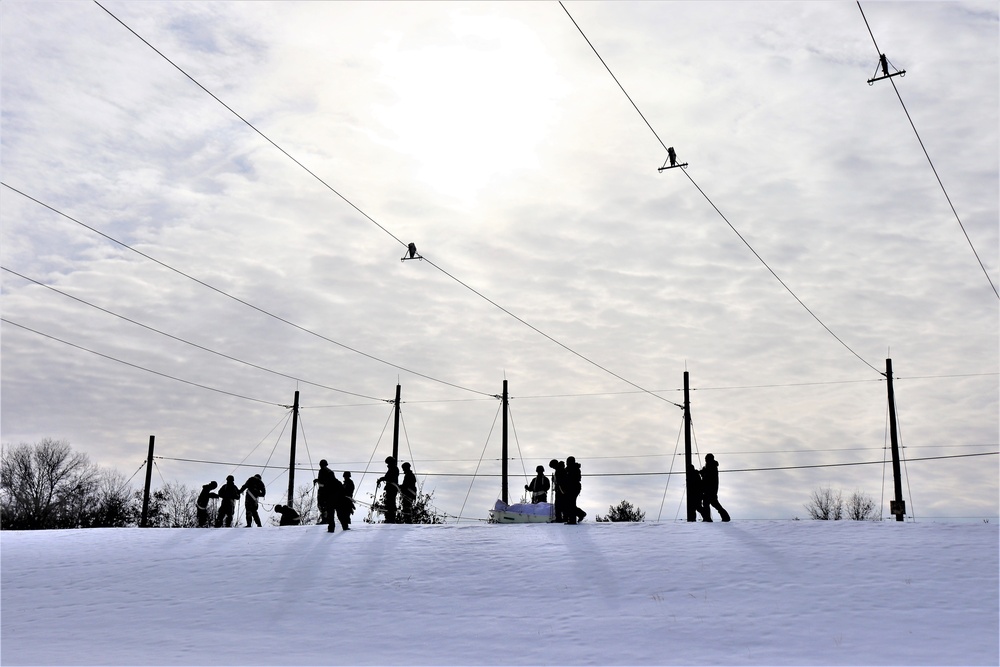 Fort McCoy CWOC class 21-03 students train using snowshoes, ahkio sleds